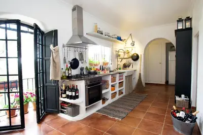 a kitchen with a stove and a counter at Casa MariSol in Arcos de la Frontera