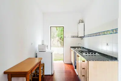 a kitchen with a sink and a stove top oven at Spacious Villa in Conil de Frontera with Private Pool in Roche