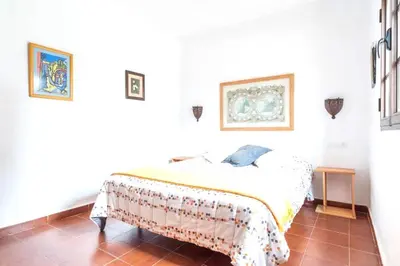 a bedroom with a bed in a white room at Spacious Villa in Conil de Frontera with Private Pool in Roche