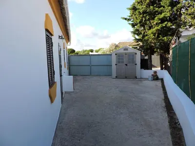 a driveway with a fence and a garage at Spacious Villa in Conil de Frontera with Private Pool in Roche
