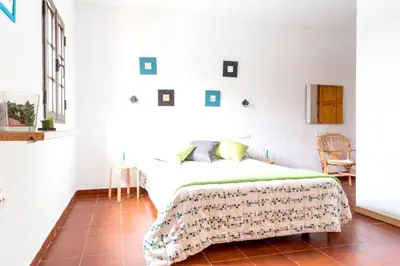 a bedroom with a bed in a white room at Spacious Villa in Conil de Frontera with Private Pool in Roche