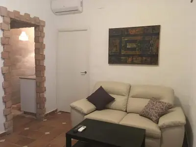 a living room with a couch and a table at Casa Maria in Rota