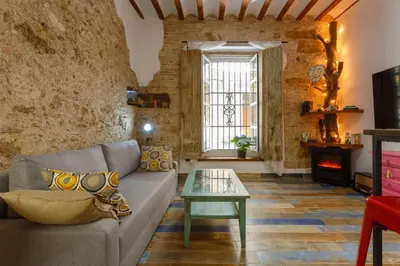 a living room with a couch and a table at Noah House city center - Historic center in Cádiz