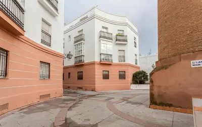 an empty parking lot in front of a building at Centro 4 Rooms 3 baños Parking in Jerez de la Frontera