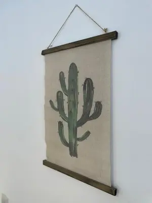 a cactus sign hanging on a wall at GATU Verano en la playa con parking, wifi, piscina in El Puerto de Santa María