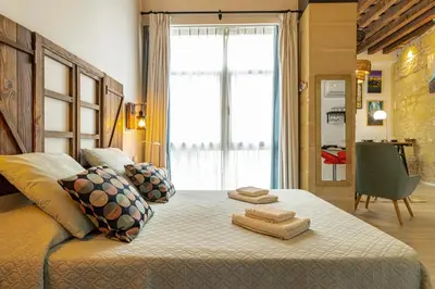 a stone floor in a room with a wooden ceiling at Exclusive Boutique in Jerez de la Frontera