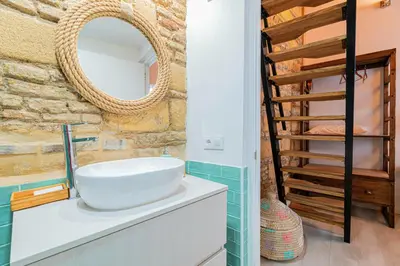 a bathroom with a sink and a mirror at Exclusive Boutique in Jerez de la Frontera