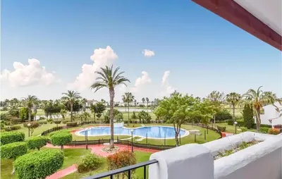 a view of the pool from the balcony of a resort at Charming Apartment in Rota with Garden and Lake Views, 81 m² in Rota