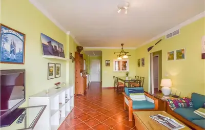 a living room with a couch and a table at Charming Apartment in Rota with Garden and Lake Views, 81 m² in Rota