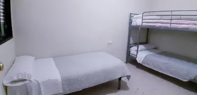 a bedroom with two bunk beds in a room at SAN JUSTO in Jerez de la Frontera