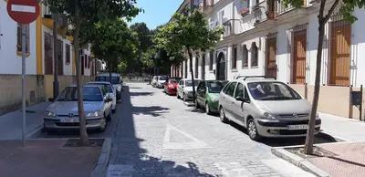 a row of cars parked on the side of a street at SAN JUSTO in Jerez de la Frontera