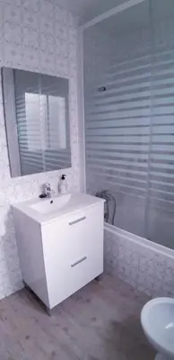 a bathroom with a sink and a mirror and a tub at SAN JUSTO in Jerez de la Frontera