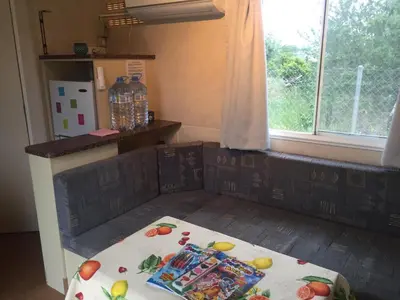 a kitchen with a table with snacks on it at The Farm Tiny House - Tiny Casa in Chiclana de la Frontera