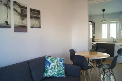 a living room with a couch and a table at CDZ - Ático Tavira in Cádiz