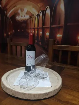 a bottle of wine sitting on top of a table at Apartamento Jerez Centro in Jerez de la Frontera