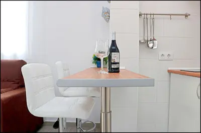 a table with a bottle of wine and a glass at Bungalow Ramos III in Conil de la Frontera