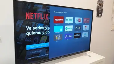 a flat screen tv sitting on top of a table at El Rincón del Tío de la Tiza in Cádiz
