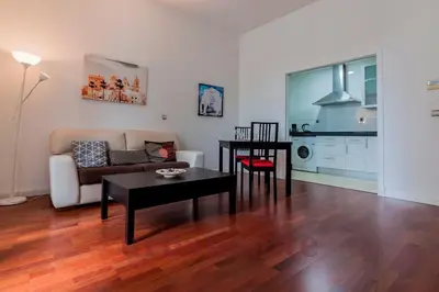 a living room with a couch and a table at Casa Comillas - Apartamento Doble in Cádiz