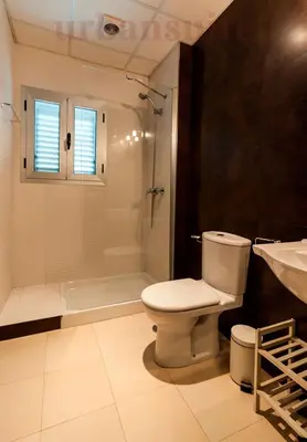 a bathroom with a toilet and a shower and a sink at Casa Comillas - Apartamento Doble in Cádiz