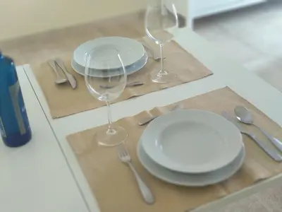 a table with white plates and wine glasses on it at ARBOLÍ DREAMS in Cádiz