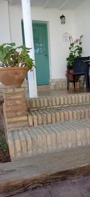 a set of stairs leading to a door of a house at La Luciérnaga in Chiclana de la Frontera