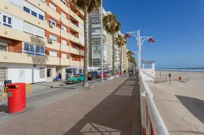 an empty street next to the beach with buildings at ALTAMAR Sunny Home by Cadiz4Rentals in Cádiz