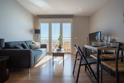 a living room with a couch and a table at ALTAMAR Sunny Home by Cadiz4Rentals in Cádiz