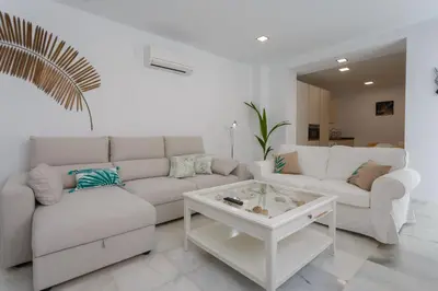 a living room with a couch and a coffee table at Apartamento La Pepa de ORO by Cadiz4Rentals in Cádiz