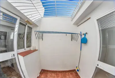 a basketball court in a room with a blue ceiling at Casa Venice in Chiclana de la Frontera