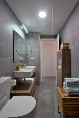 a bathroom with a sink and a toilet and a mirror at GATU Villa Alameda in Cádiz