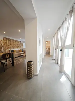 a hallway of a house with a living room at Apartamento El Tanguillo Little Apartments in Cádiz