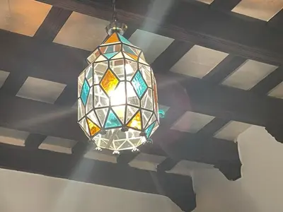 a chandelier hanging from a ceiling in a room at Casa Antigua - Terraza con Vistas al Mar in Medina Sidonia