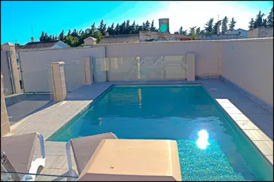 a small swimming pool in a house with at Chalet Peñuelas con piscina in Conil de la Frontera