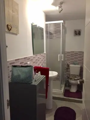 a bathroom with a sink and a toilet at Modern Seaside Apartment 700 mt from beach in El Puerto de Santa María