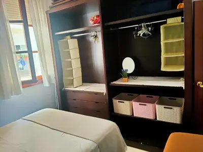 a room with a closet with baskets and a mirror at Apartamento en pleno centro de Cadiz con parking economico in Cádiz