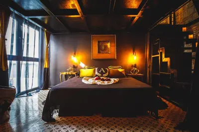 a bedroom with a bed with a tray of food on it at Semiloft Romantico Catedral con soleada azotea comunitaria in Jerez de la Frontera