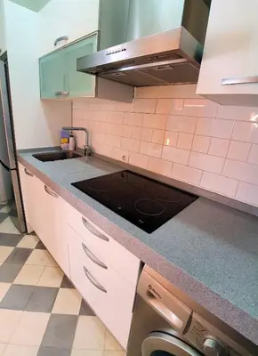 a kitchen with a sink and a stove top oven at APARTAMENTO APODACA in Cádiz