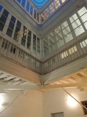 a large building with a ceiling with windows at APARTAMENTO APODACA in Cádiz