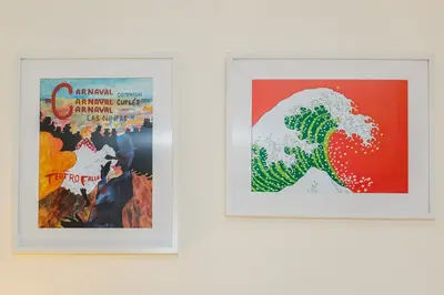 a pair of framed posters on a wall at La Sorpresa del GENOVES by Cadiz4Rentals in Cádiz