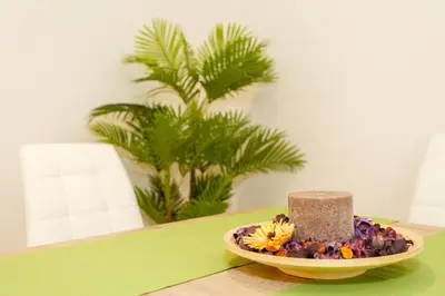 a plate of food with a candle on a table at La Sorpresa del GENOVES by Cadiz4Rentals in Cádiz