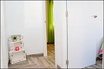 a room with a white closet with a glass door at Chalet Ermita in Conil de la Frontera