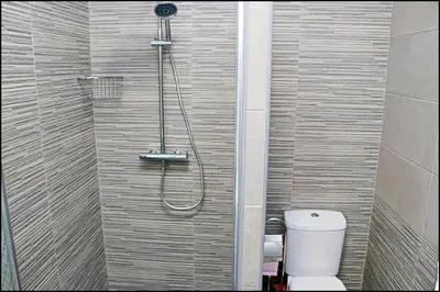 a bathroom with a shower with a toilet at Chalet Ermita in Conil de la Frontera