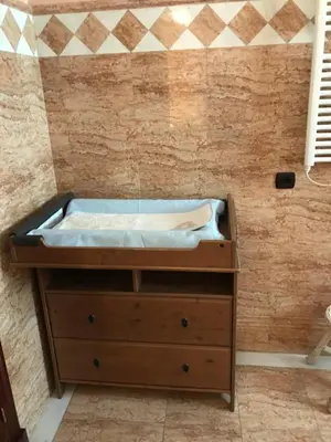 a bed on top of a wooden dresser in a room at Bahía blanca SM in Cádiz