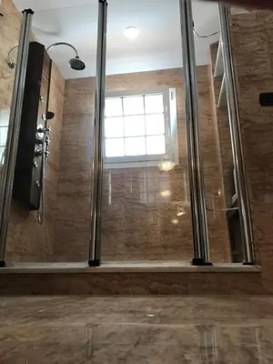 a bathroom with a shower with a window at Bahía blanca SM in Cádiz
