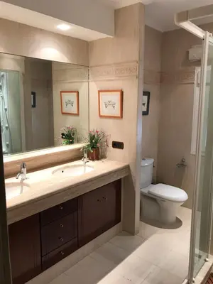 a bathroom with a sink and a toilet and a mirror at Bahía blanca SM in Cádiz