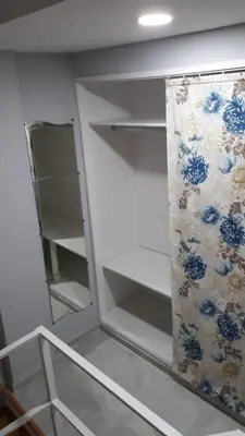 a room with a closet with a mirror at Duplex Daises in San Fernando
