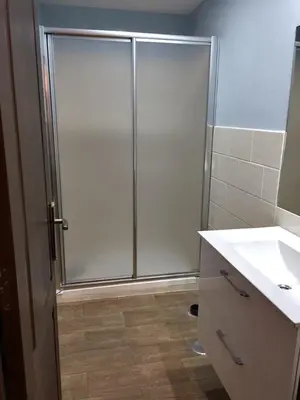 a bathroom with a shower with a sink and a counter at Casa Ananda y Casa Rengue in Conil de la Frontera