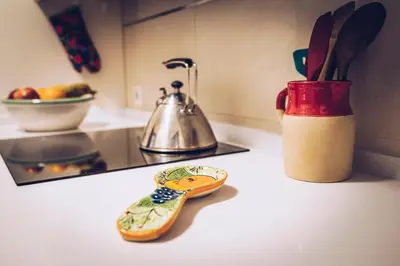 a kitchen counter with a spoon and a tea kettle at apartamento Jacaranda centro in El Puerto de Santa María