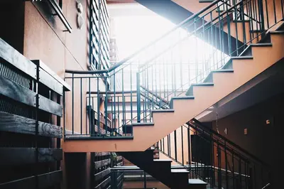 a staircase in a building next to a building at apartamento Jacaranda centro in El Puerto de Santa María