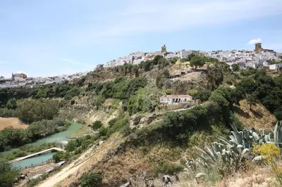 a hill with houses on top of a mountain at Duque de Boliches in Arcos de la Frontera